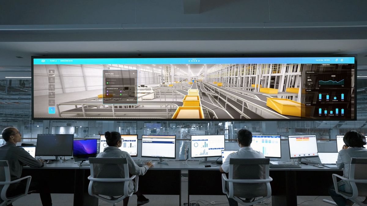 Security analysts monitoring systems in a control room